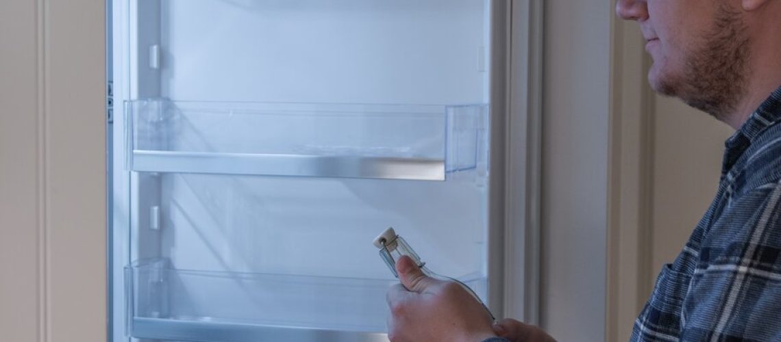 person using his refrigerator